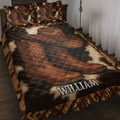 Cowboy quilt blanket bedding set displayed on a bed with Western hats, boots, and rustic brown artwork