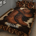 Close view of a Western cowboy quilt blanket featuring leather boots, cowboy hats, and rustic geometric borders