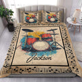 Drum quilt bedding styled in a bright bedroom with colorful drum kit artwork and musical note borders