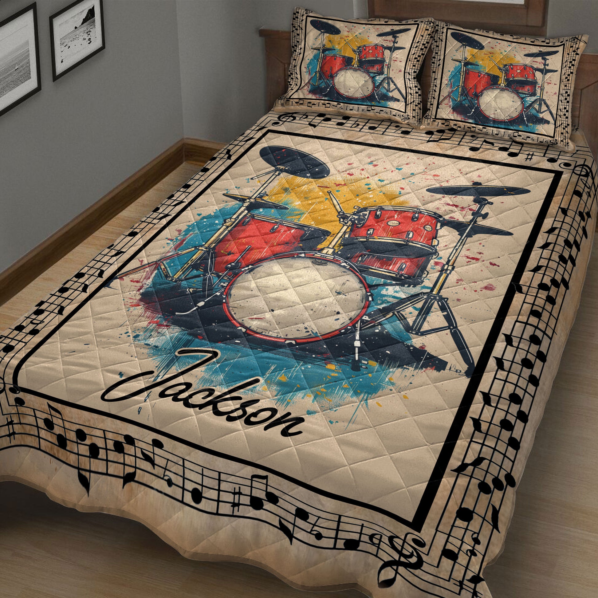Close bedroom view of a drum quilt blanket featuring a colorful red drum set and music note design