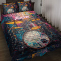 Colorful custom drum quilt blanket spread across a bed with matching drum artwork on the pillowcases