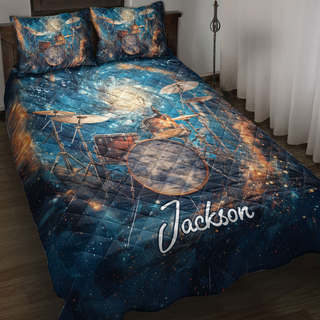 Drum quilt blanket displayed on a bed with cosmic artwork, cymbals, and a vivid blue music theme