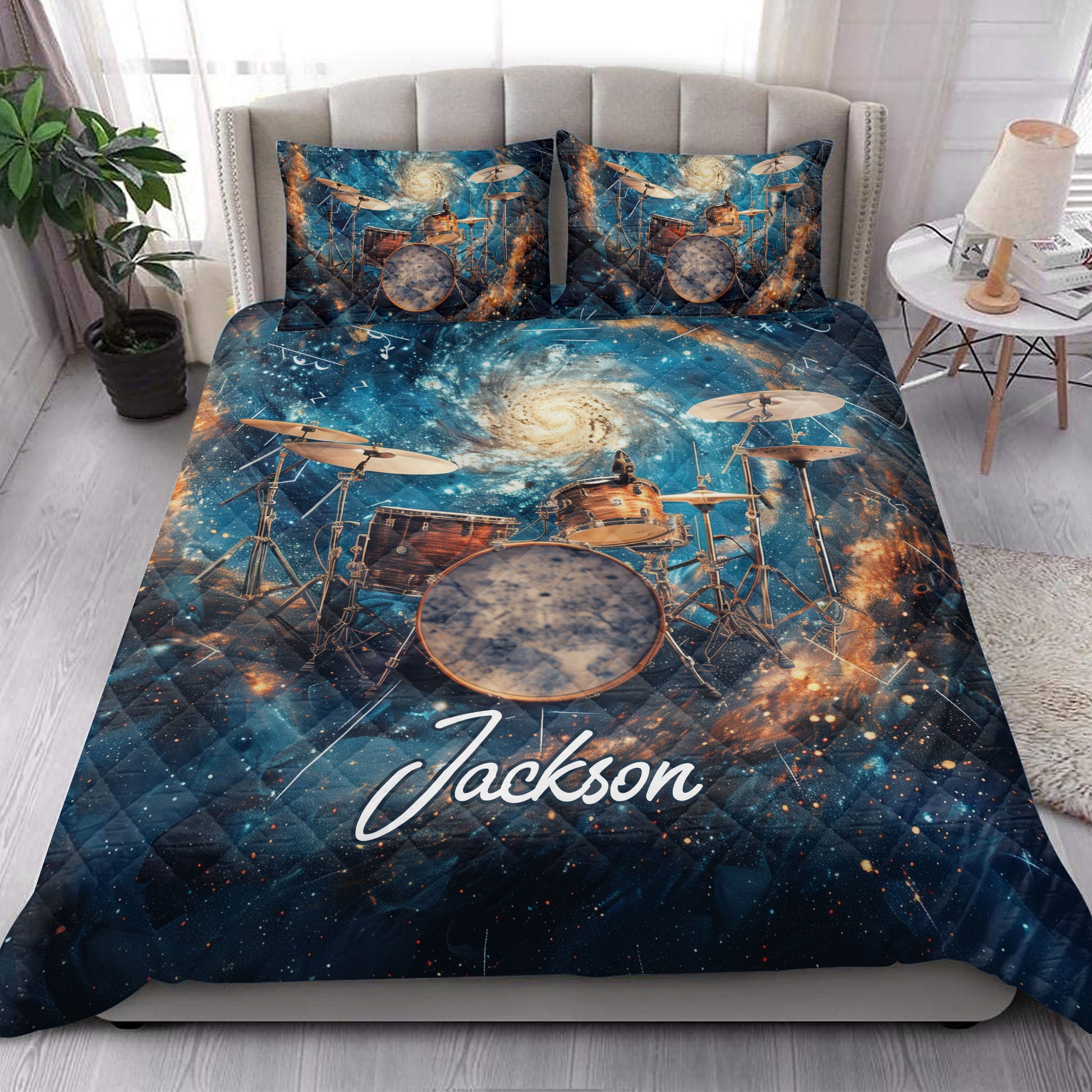 Drum quilt bedding set styled in a bright bedroom with matching cosmic drum artwork on the bed