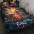 Drum kit quilt blanket displayed on a bed with cosmic orange and blue music artwork