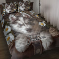 Husky quilt blanket bedding set with daisies displayed on a rustic bedroom bed