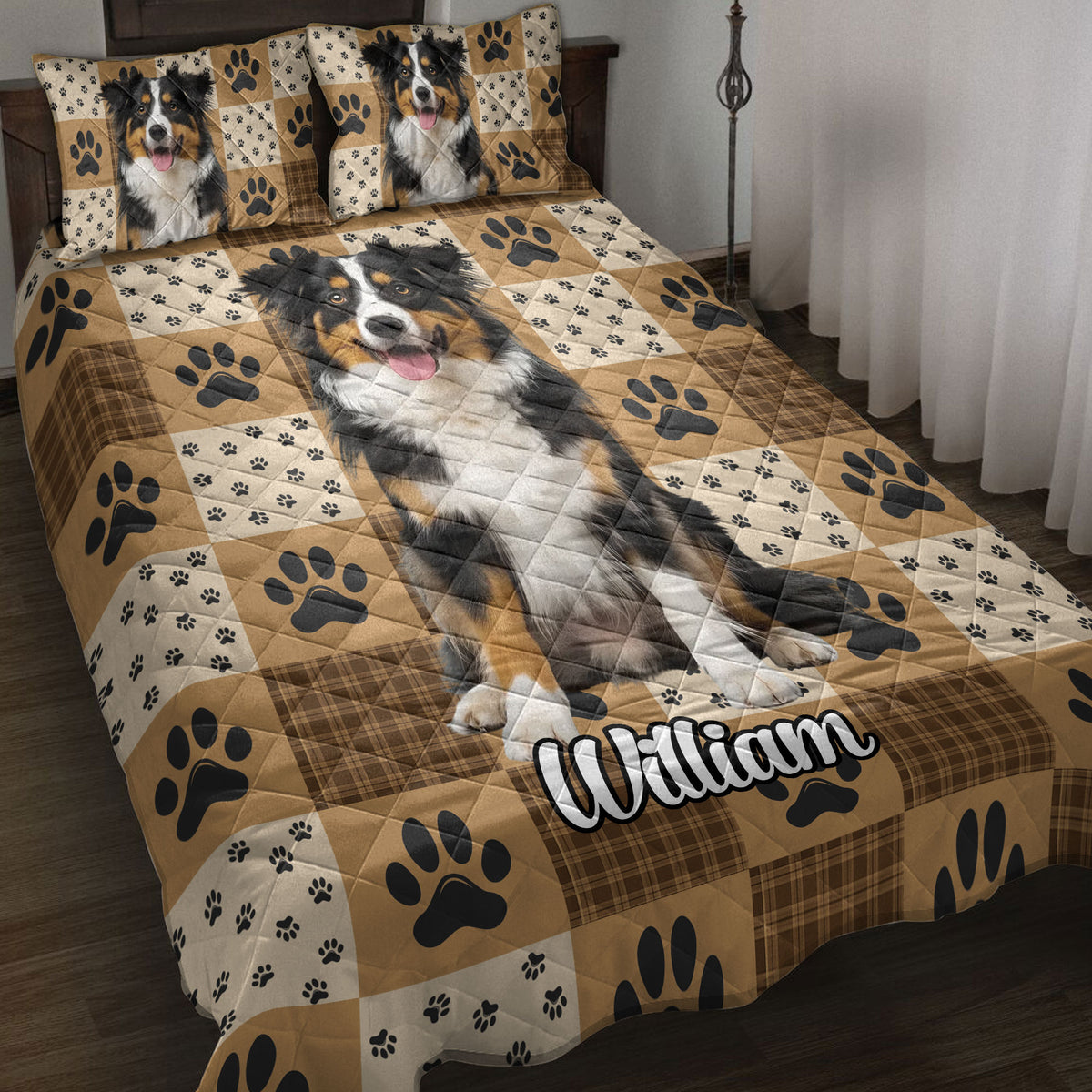 Australian Shepherd quilt blanket bedding set on a bed with paw prints, plaid accents, and warm tan tones