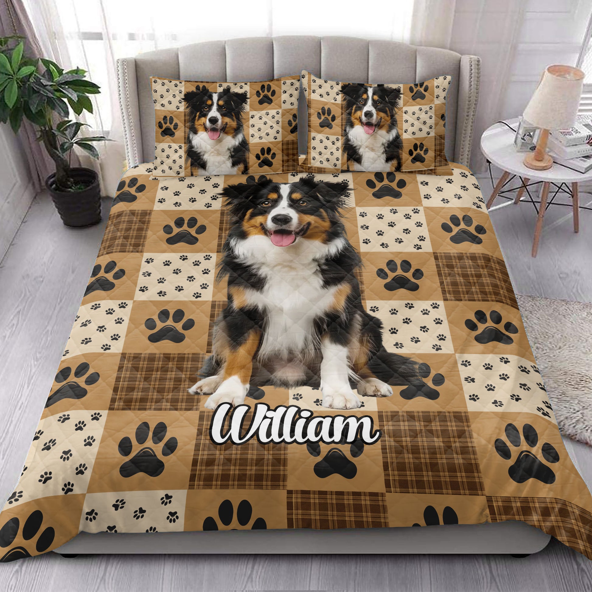 Australian Shepherd quilt bedding set styled in a bright bedroom with dog portraits and paw print artwork