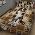 Australian Shepherd quilt blanket spread across a bed with a large dog portrait, paw prints, and rustic plaid details