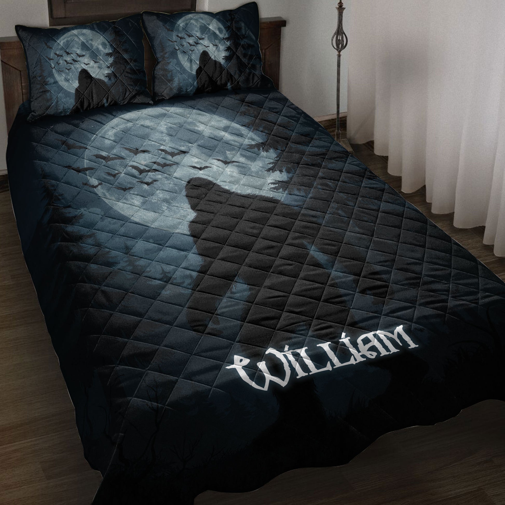 Bigfoot quilt blanket on a bed with a moonlit forest, bats, pine trees, and dark blue artwork