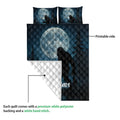 Bigfoot quilt blanket showing the printed moonlit forest side and white quilt backing