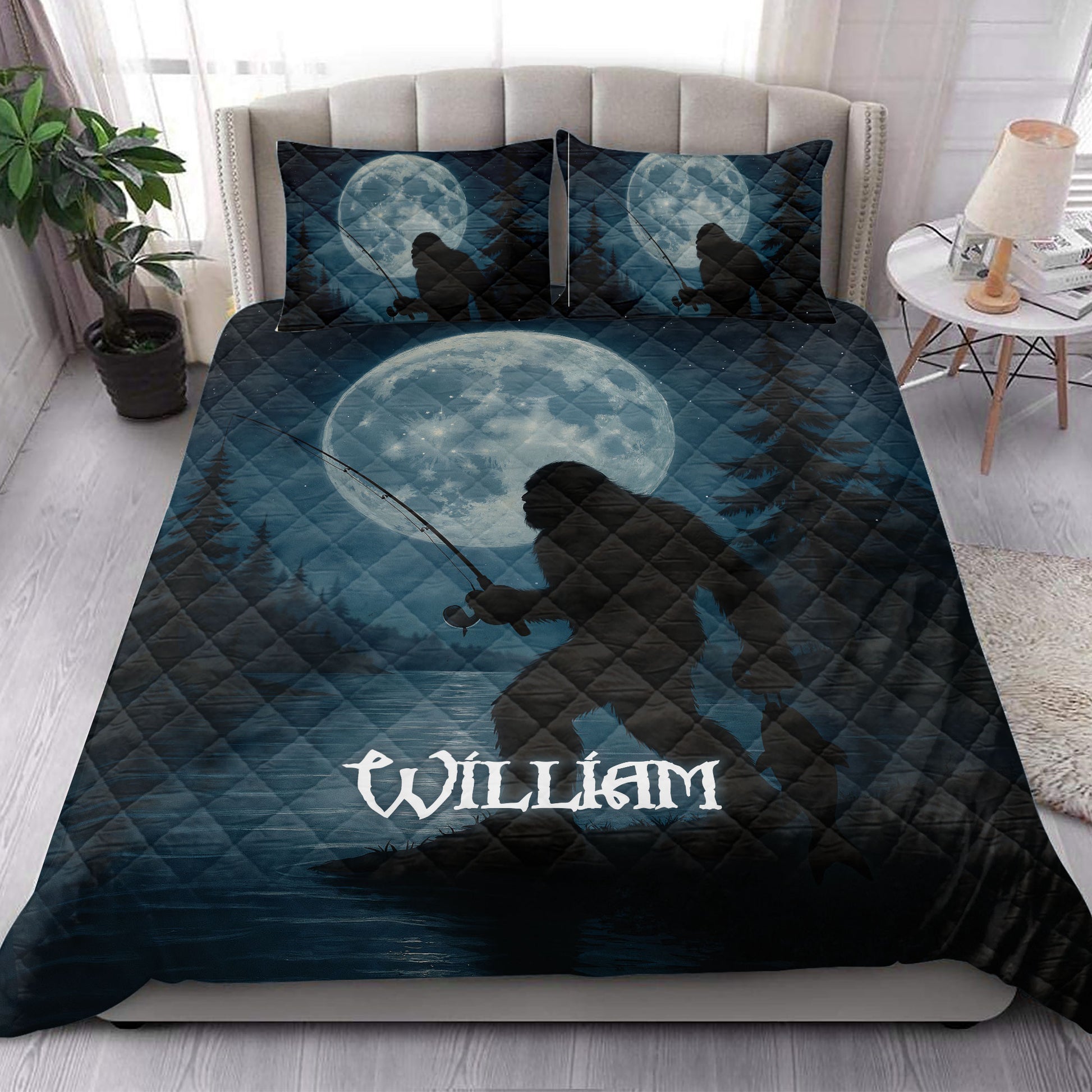 Bigfoot quilt bedding styled on a bedroom bed with moon, forest and Sasquatch artwork