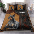 Doberman quilt blanket styled on a bedroom bed with bold black and tan dog artwork
