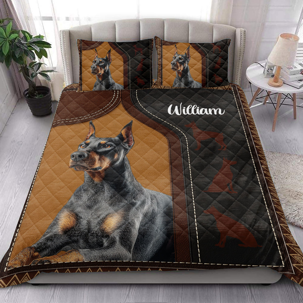 Doberman quilt blanket styled on a bedroom bed with bold black and tan dog artwork