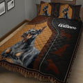 Close bedroom view of a Doberman quilt blanket with brown, black, and geometric border details