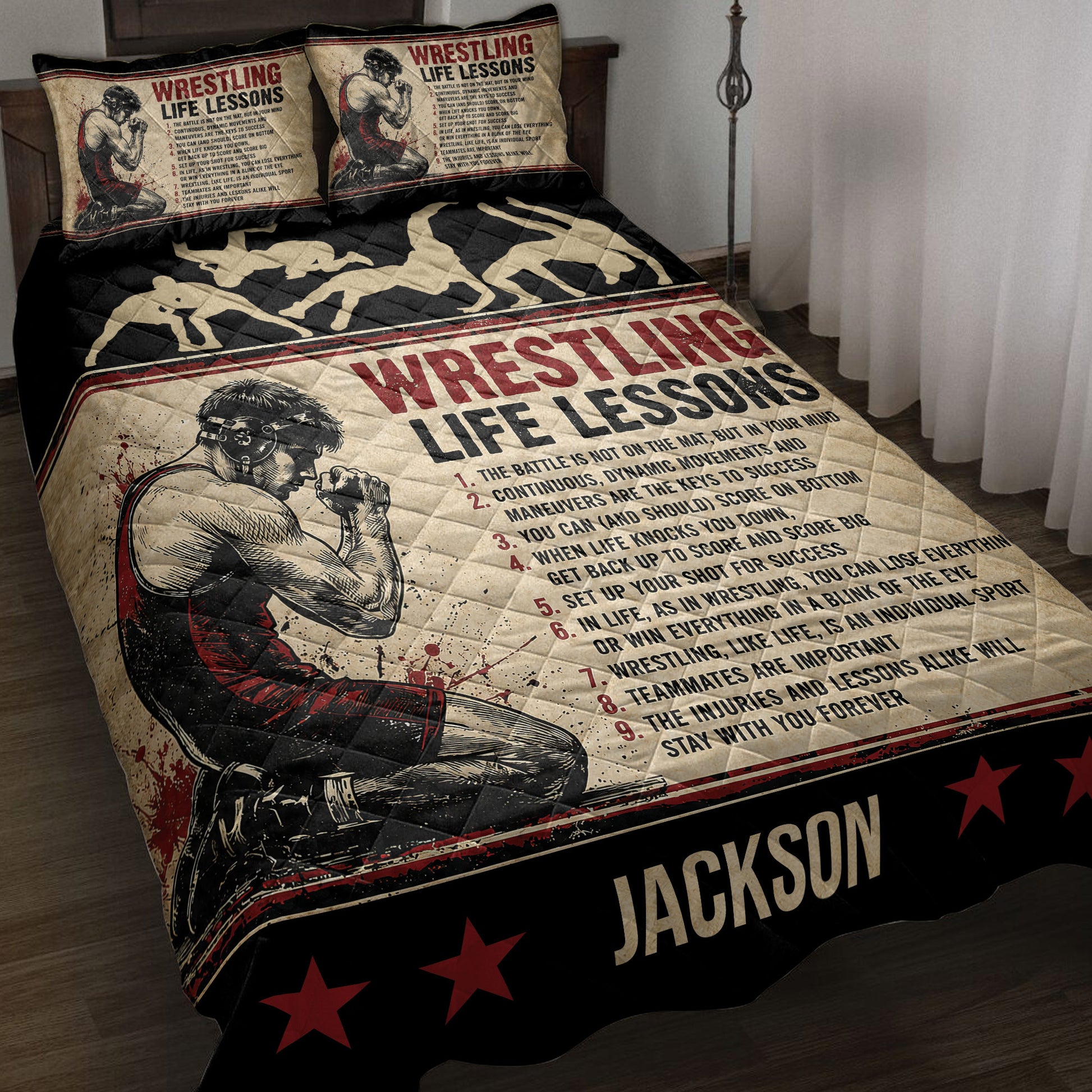 Wrestling quilt blanket displayed on a bed with grappling silhouettes, red stars, and motivational sports artwork