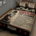 Wrestling quilt blanket shown at an angle with grappler artwork, motivational text, and black red decor