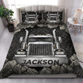 Semi truck quilt blanket styled on a bedroom bed with matching truck artwork on the pillows