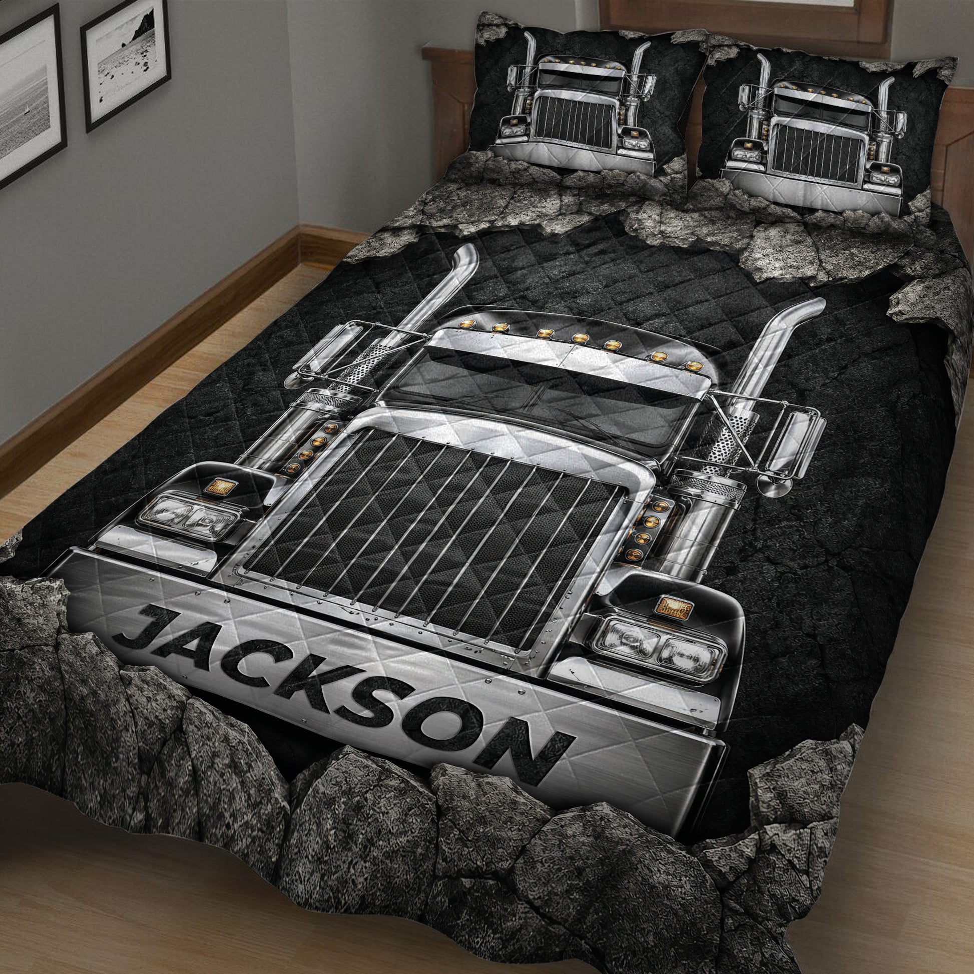 Close-up view of a black trucker quilt blanket featuring detailed chrome semi truck artwork