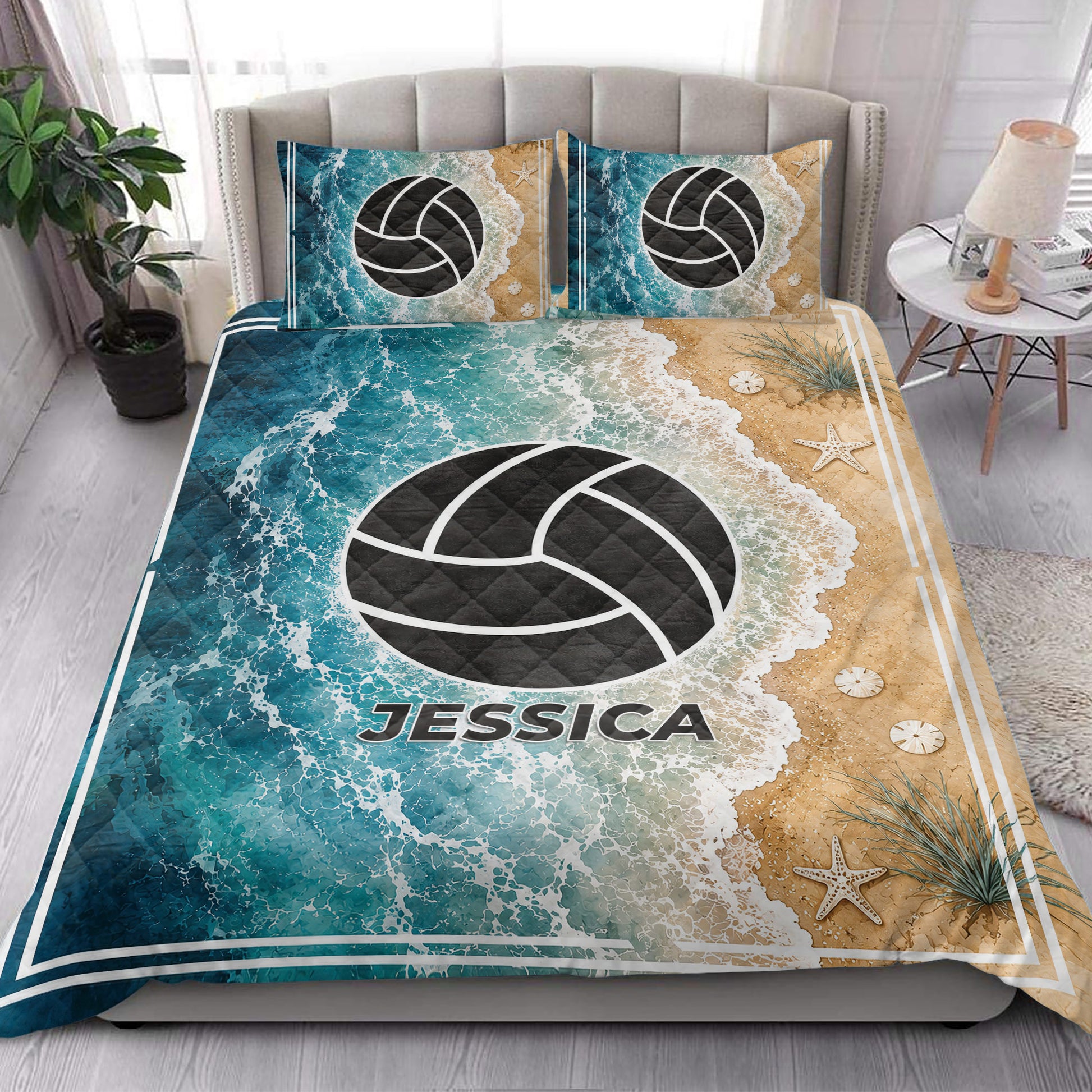 Volleyball quilt blanket styled in a bright bedroom with teal ocean artwork, sandy beach accents, and starfish