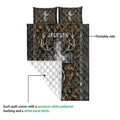 Hunting quilt showing a printed woodland design with deer antlers, arrows, braided borders, and quilted backing