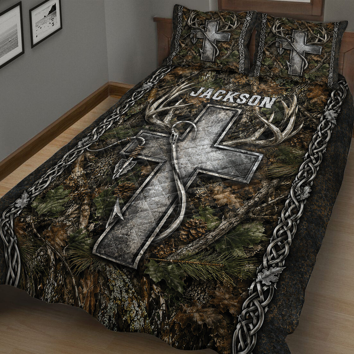 Close view of hunting quilt blanket featuring camouflage foliage, large deer antlers, arrows, and dark woodland colors