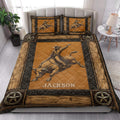 Rustic rodeo quilt blanket styled on a bedroom bed with bull rider artwork and Western star accents