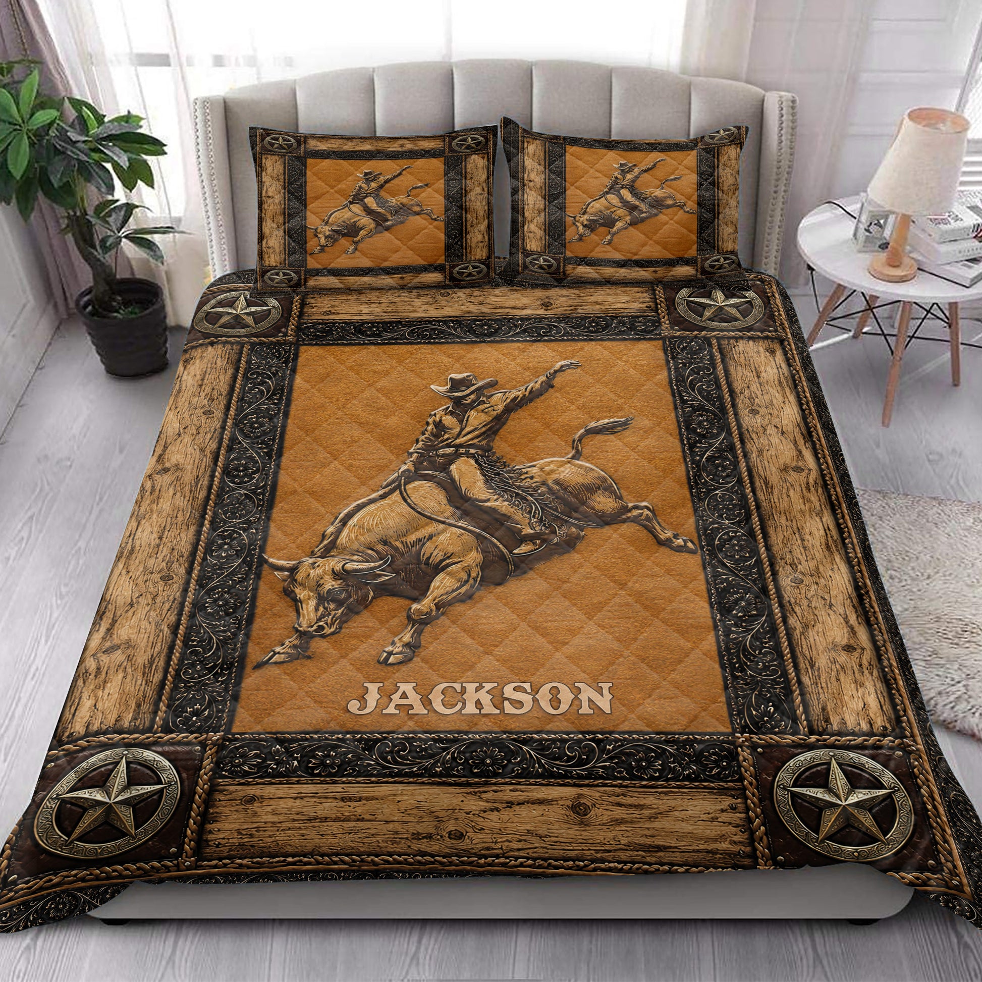 Rustic rodeo quilt blanket styled on a bedroom bed with bull rider artwork and Western star accents