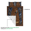 Fishing quilt showing its printed hook design and white quilted backing in a close product construction view
