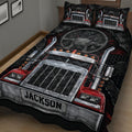 Close view of a trucker quilt blanket featuring a detailed red semi truck and dashboard design
