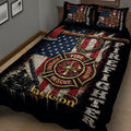 Close bedroom view of firefighter quilt featuring a rescue emblem, axe, fire truck, and patriotic design