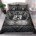 Racing quilt bedding styled in a bright bedroom with checkered flags and metallic motorsport artwork