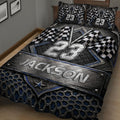 Close view of a racing quilt blanket with checkered flags, bold blue accents, and industrial automotive-inspired texture