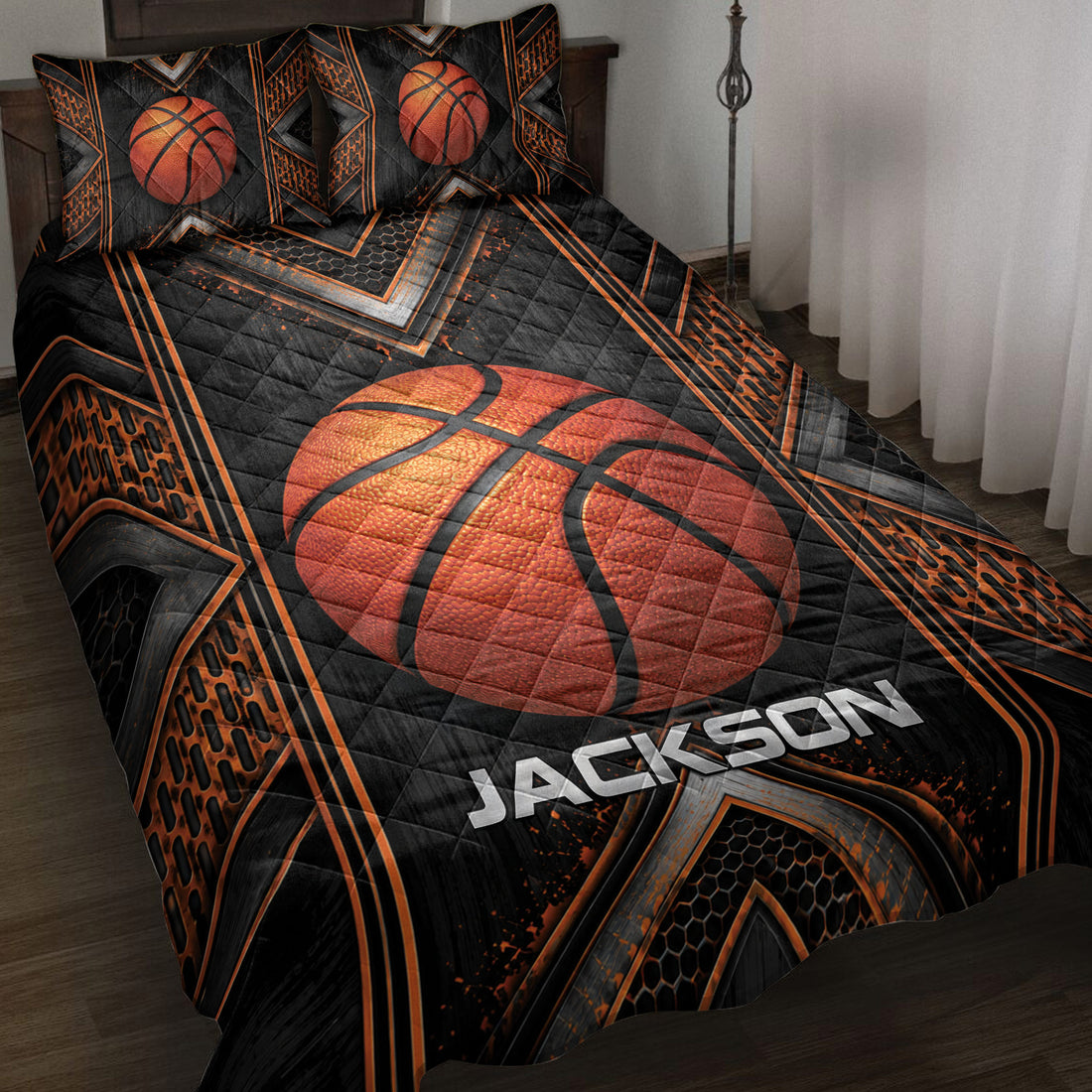 Basketball quilt blanket spread across a bed with bold black, orange, and geometric sports artwork