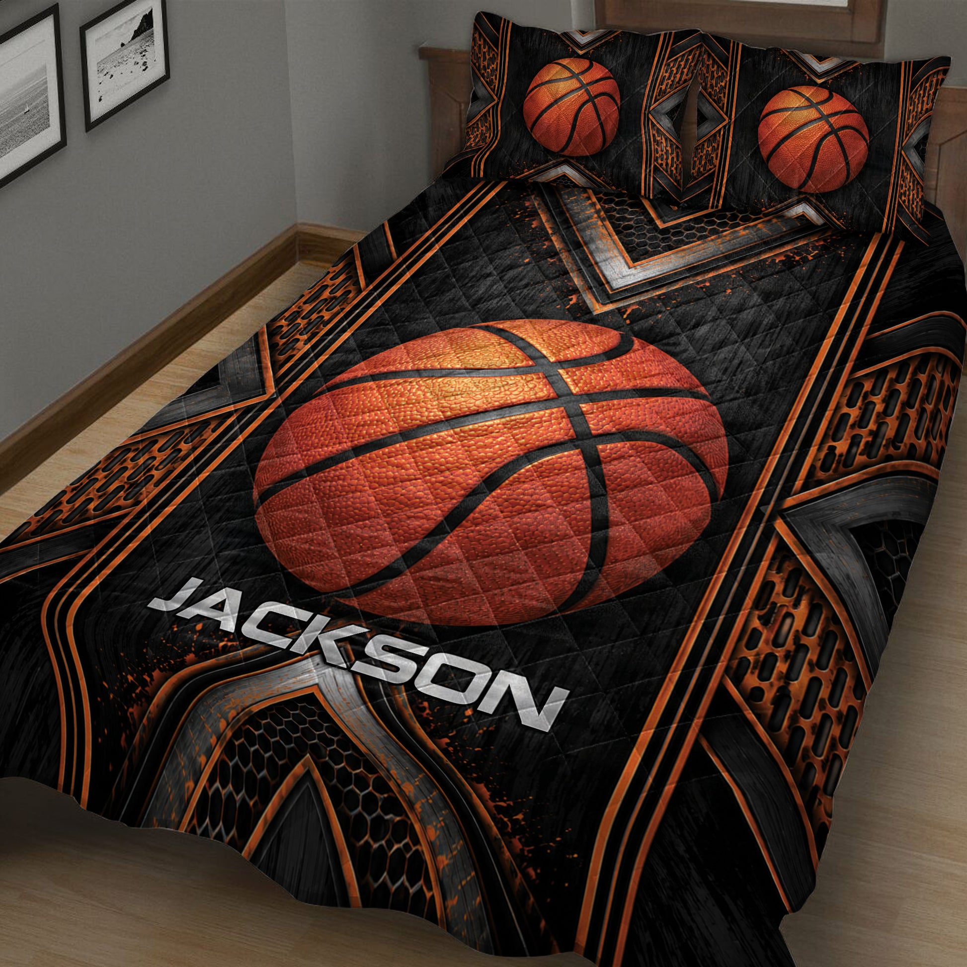 Close view of basketball quilt blanket featuring a large orange basketball and dramatic black-orange pattern