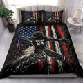 Baseball quilt blanket styled in a bright bedroom with bold player artwork and patriotic flag-inspired colors