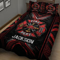 Angled bedroom view of a firefighter quilt blanket with helmet, ladder, hydrant, and crest artwork