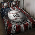 Baseball quilt blanket displayed on a bed with large baseball artwork and bold red, white, and navy design