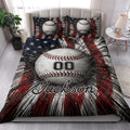 Baseball quilt bedding styled on a bedroom bed with bold baseball artwork and red, white, and navy colors