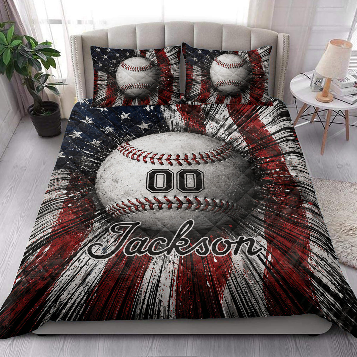 Baseball quilt bedding styled on a bedroom bed with bold baseball artwork and red, white, and navy colors