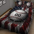 Close view of baseball quilt blanket with large baseball artwork and dramatic red, white, and navy pattern