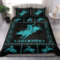Rodeo quilt bedding styled on a bed with turquoise bull riders, western borders, and black diamond quilting