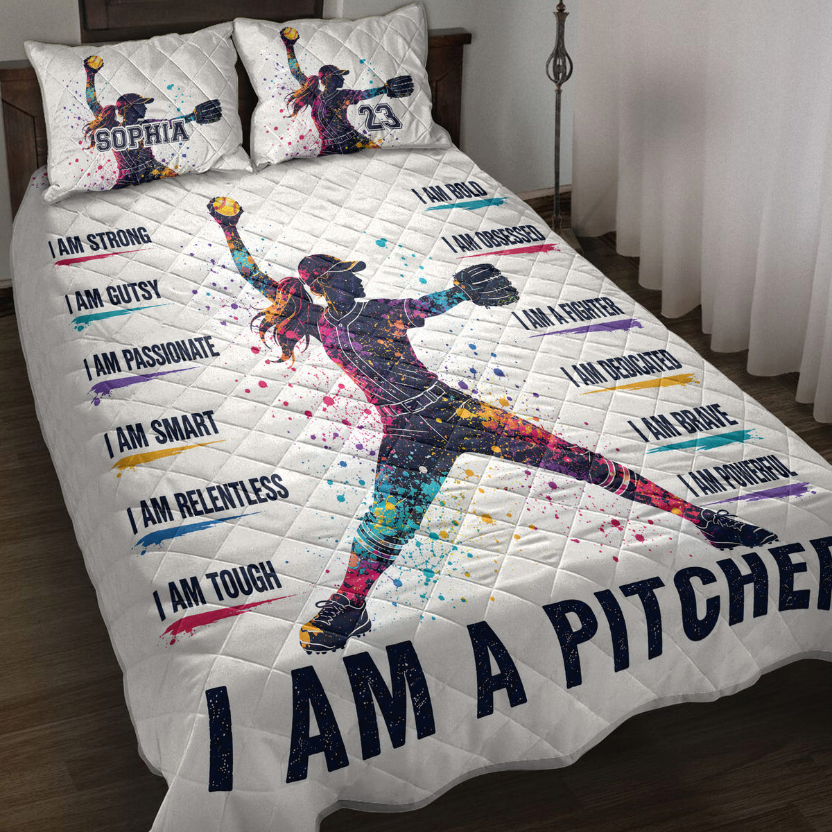 Softball quilt blanket bedding set displayed on a bed with colorful female pitcher artwork and motivational sports design