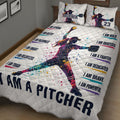 Angled bedroom view of a colorful softball quilt blanket featuring a female pitcher and motivational sports artwork