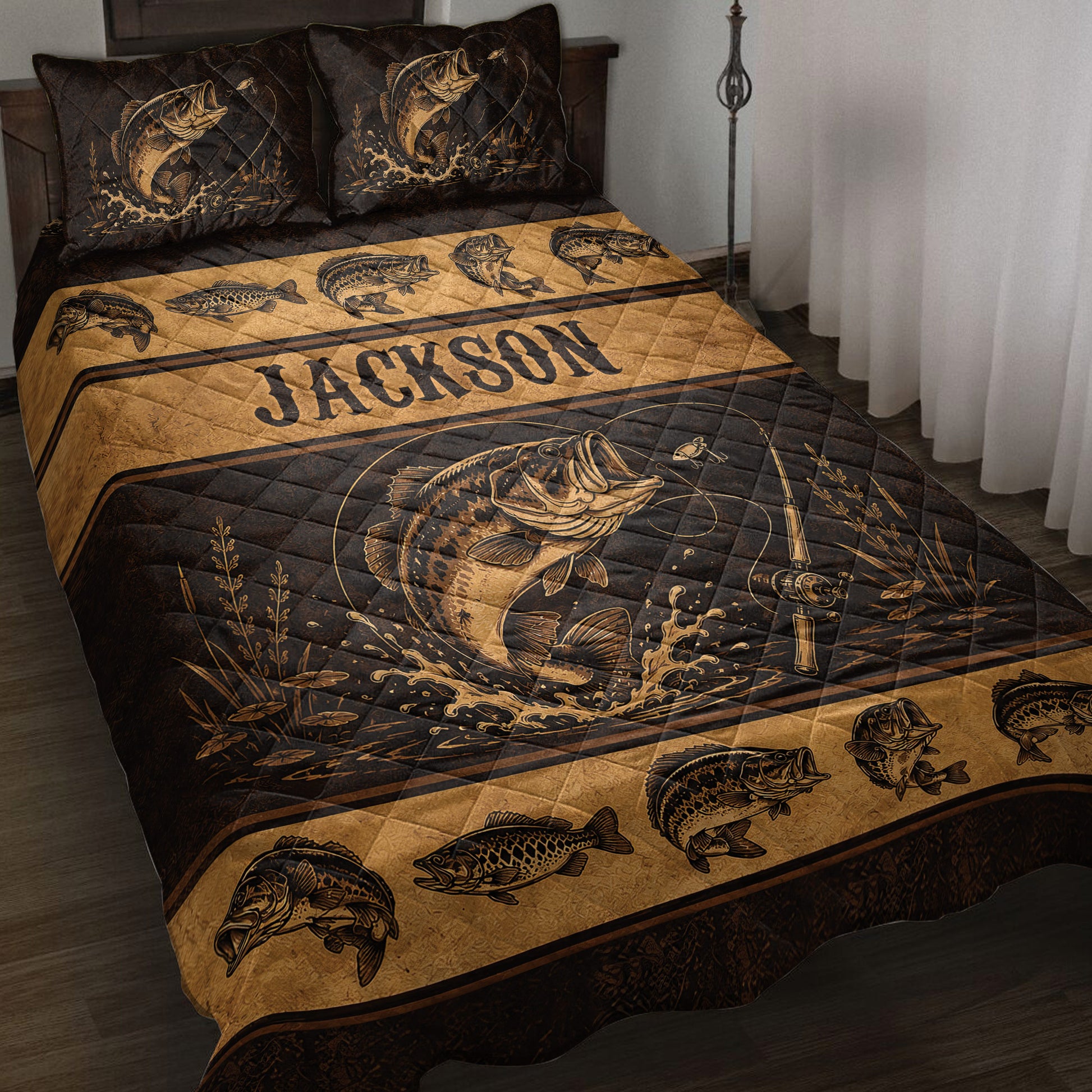 Fishing quilt blanket displayed on a bed with bass artwork, fishing rods, water splashes, and rustic black and gold styling