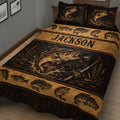Close view of a fishing quilt blanket featuring detailed bass illustrations, fishing rods, lures, and rustic artwork