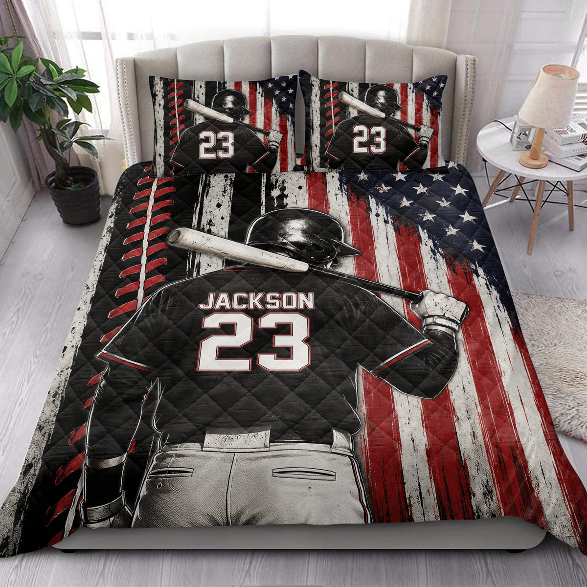 Baseball quilt blanket styled on a bedroom bed with dramatic batter artwork and patriotic red, white, and blue colors