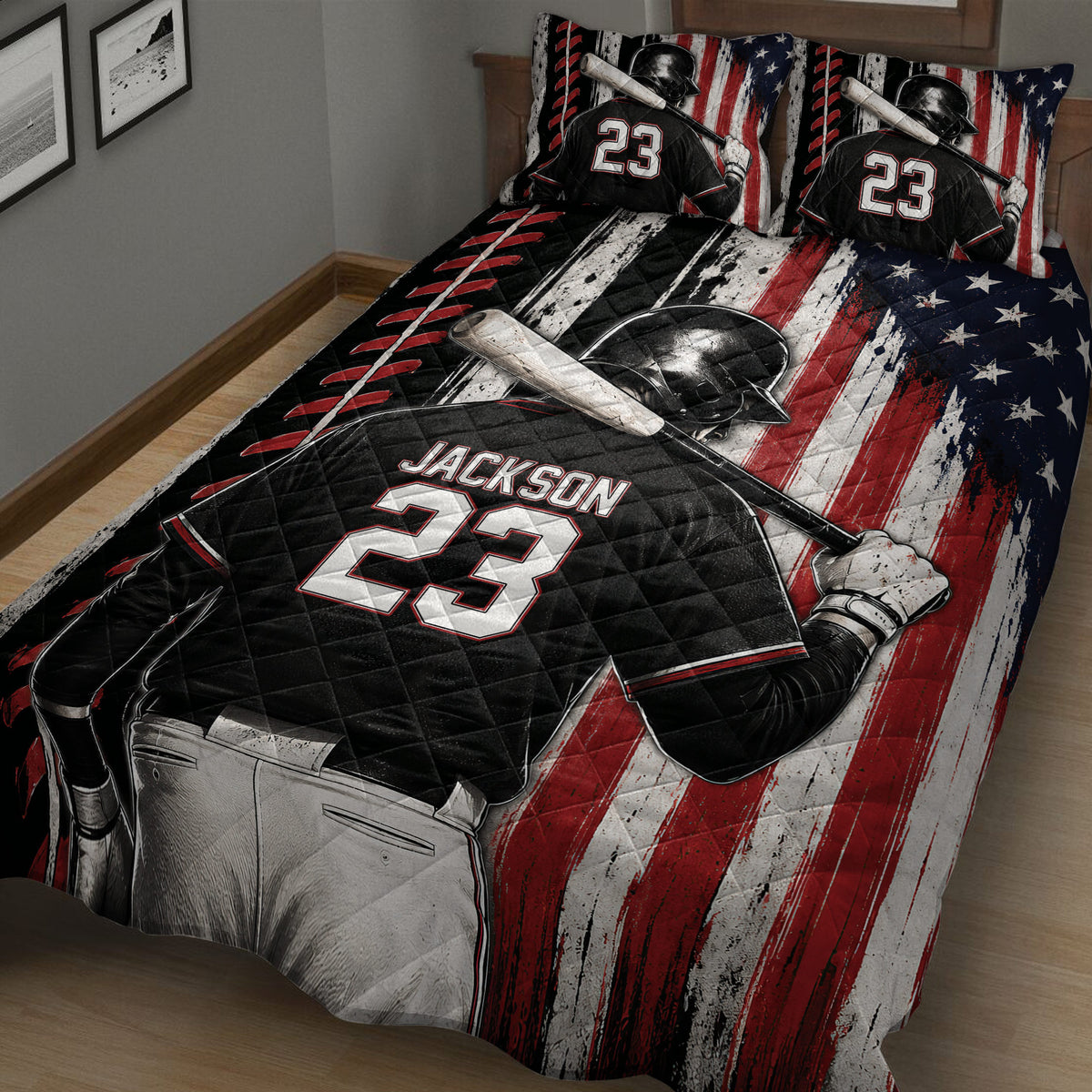 Close bedroom view of a baseball quilt featuring a batter, crossed bat, baseball stitching, and distressed patriotic artwork