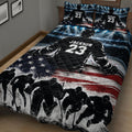Hockey quilt blanket shown in a bedroom with dramatic arena lights, ice rink artwork, hockey players, and patriotic stripes