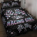 Racing quilt blanket displayed on a bed with crossed checkered flags, stars, and bold black and pastel artwork
