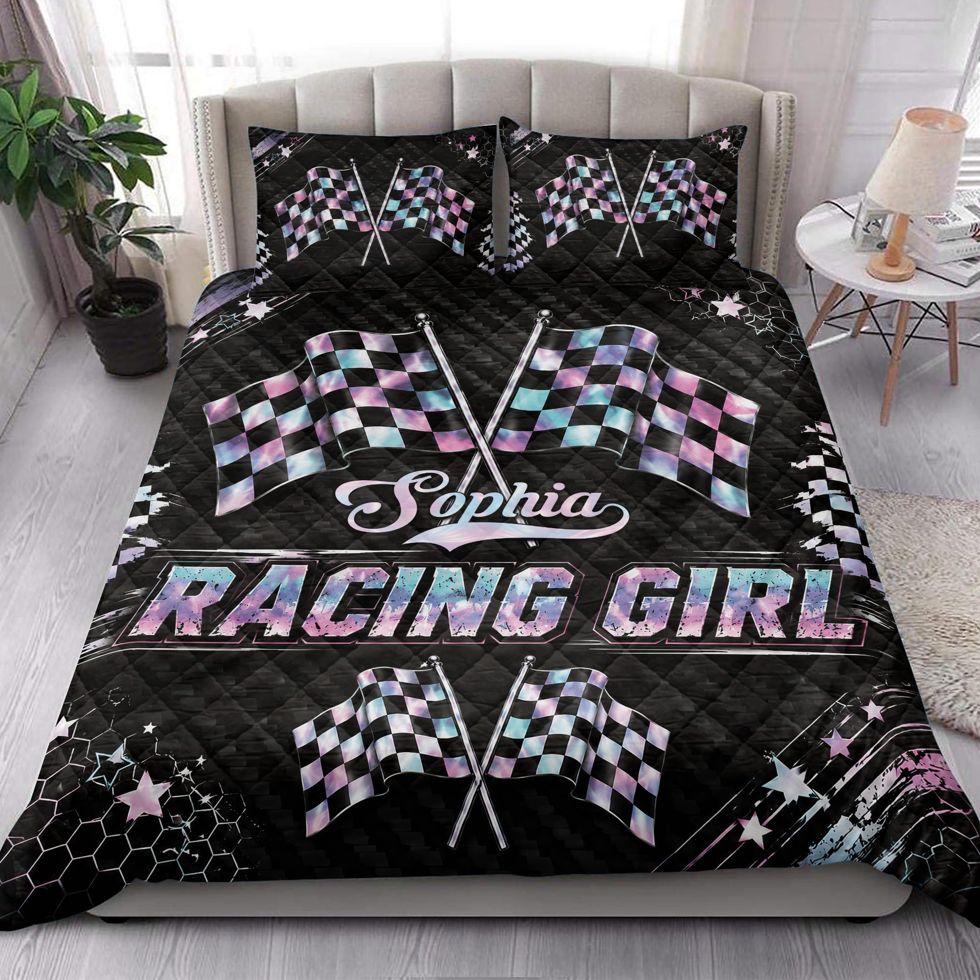 Racing quilt bedding styled in a bright bedroom with crossed checkered flags and colorful racing graphics